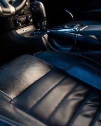 Close-up of a luxurious car interior with leather seating, showcasing style and comfort.